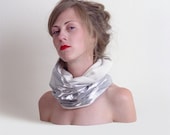 Silvery scarf with a warm white covering inside