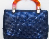 shimmery navy blue mesh handbag with tortoise lucite handle