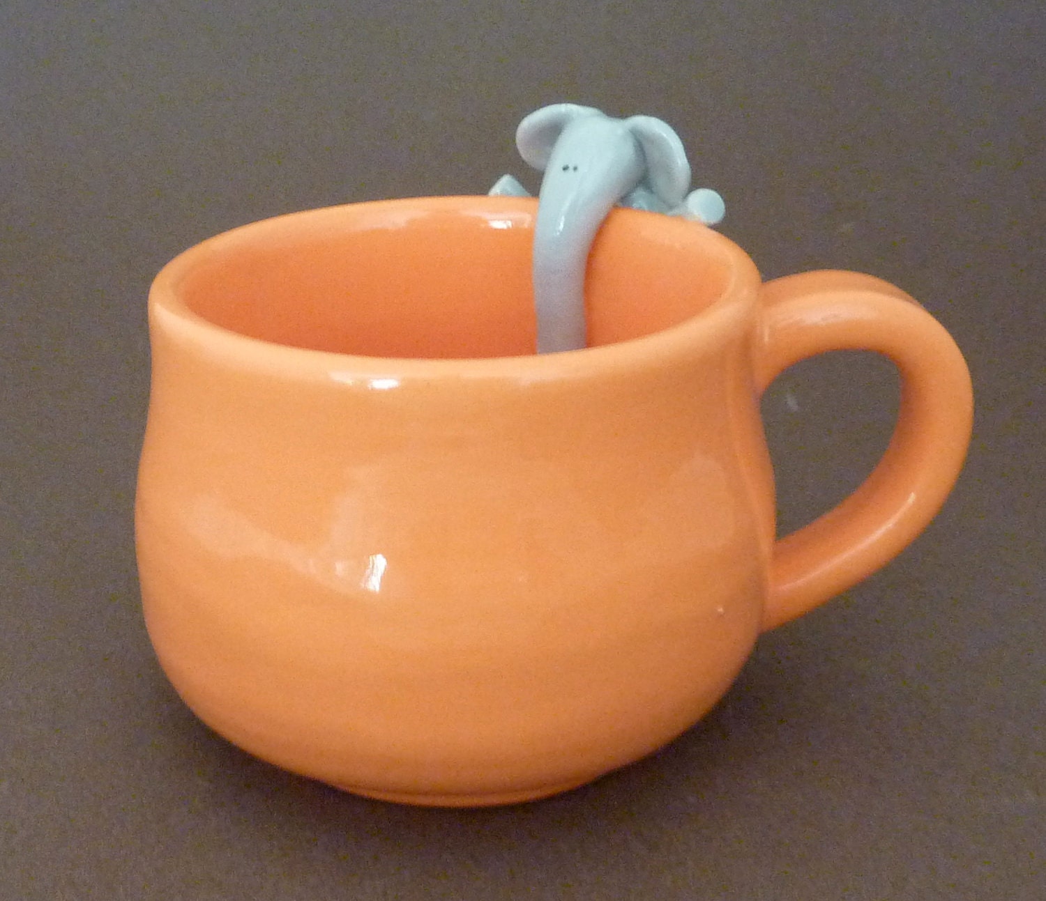 Orange mug with elephant
