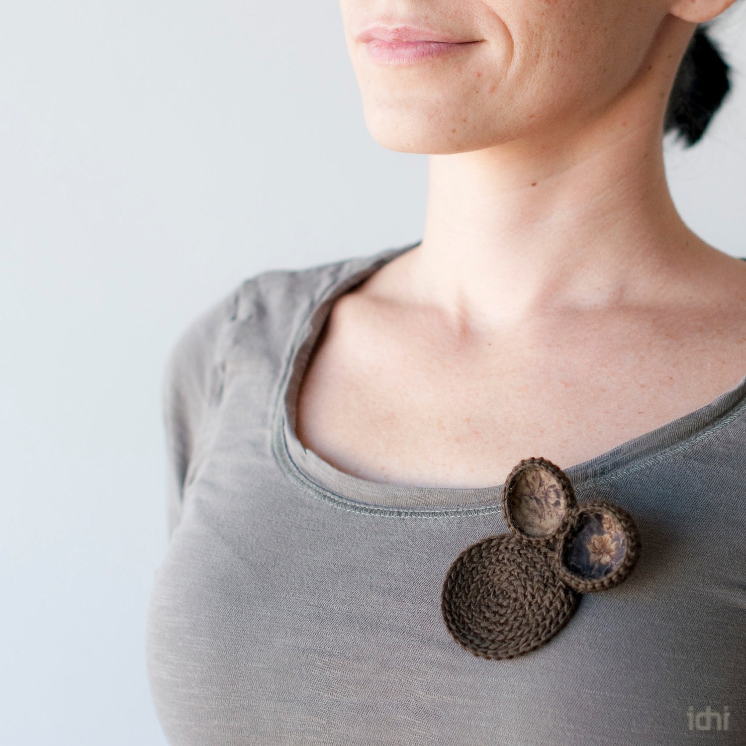 Brooch crochet circles with with fabrics. Brown.