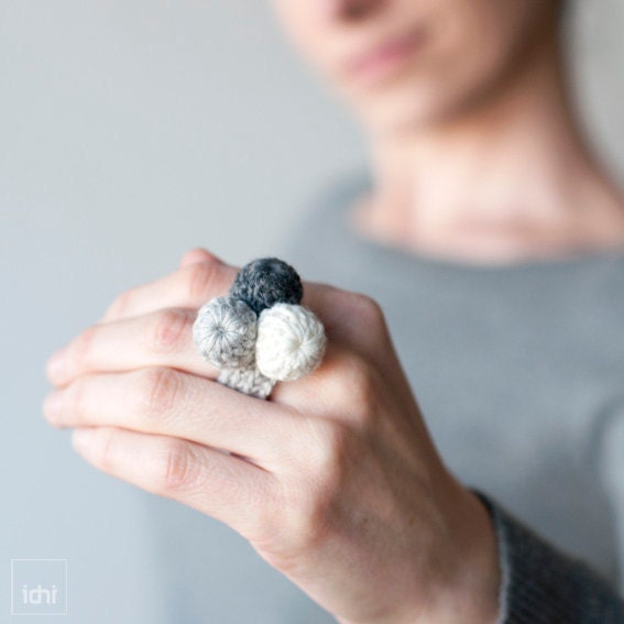 Ring crocheted balls. Combination of gray .