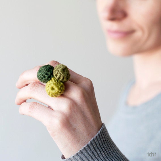 Ring crocheted balls. Combination of green .