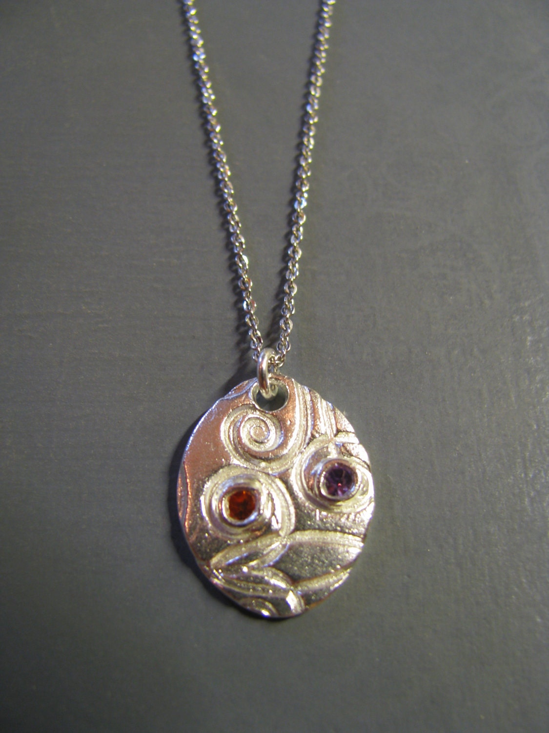 Fine Silver Handmade Whimsical Oval Charm with Cubic Zirconia's of Red and Purple Strung on Sterling SIlver Chain
