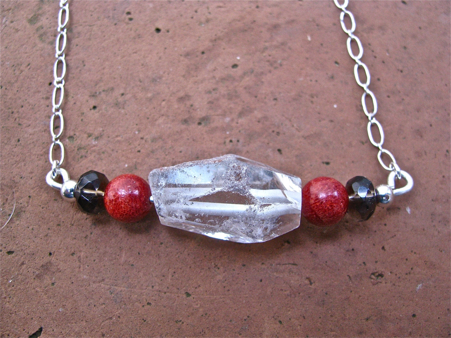 Raw Crystal Quartz Focal Bead Mixed with Coral and Smokey Quartz  Beads Accented with a Sterling Silver Beads Chain & Closure