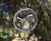 hand engraved glass bird on a flower etching