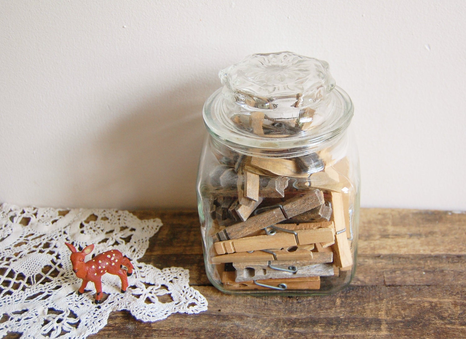 Vintage apothecary jar of clothespins