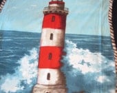 Light House and Crashing Waves with Sky Blue Fleece Blanket