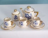 mini teaset with delicate blue flowers and 22kt gold