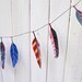 Illustrated paper feather garland