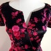 Hold for CINDY CHRISTIAN DIOR Couture 1950's vintage dress. Black Silk, Fuschia Pink Velvet Floral Print. Boned, Nipped Waist.