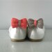 Opposites attract. Crochet bow shoe clips.Coral and sand.