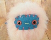 Raglan the plush monster miniature pastel pink and blue stuffed animal