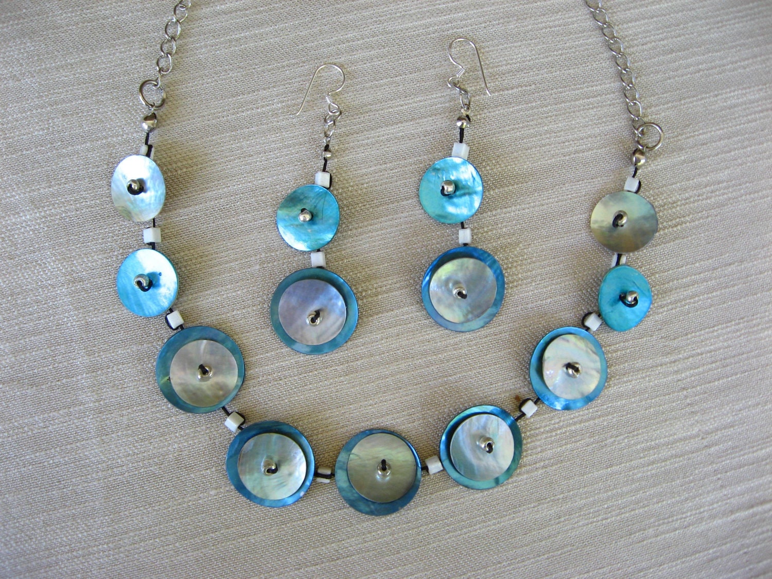 BUTTONS JEWELRY button neklace ,white pearl buttons with silver chain . buy necklace get earring in  the same colours for  FREE