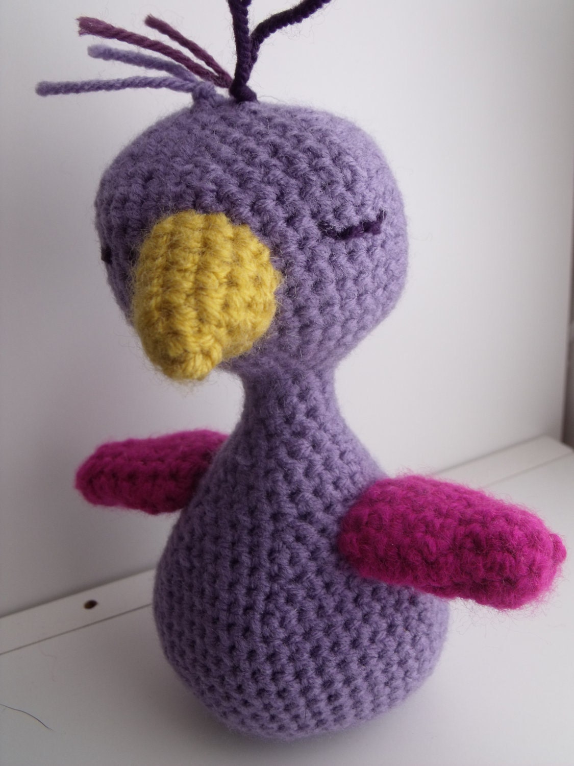 Purple sleeping Bird