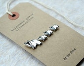 parade of badgers brooches - set of four illustrated badger brooches - modern minimal hand drawn pin badges - elizabeth pawle