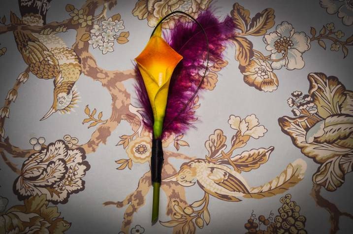 Orange Calla Lily Boutonniere with Purple Feathers