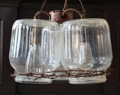 Hanging Light: 3 Glass Chicken Gallon Drinkers and Barbed Wire
