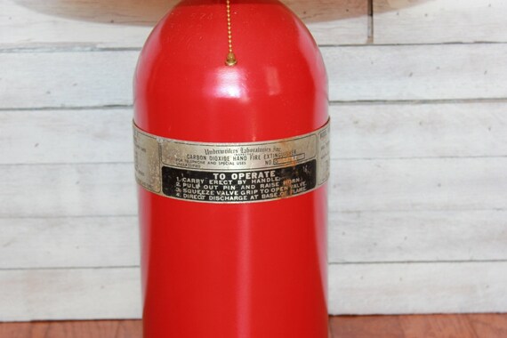 Table Lamp: Reclaimed Upcycled Fire Extinguisher with original aluminum band with instructions