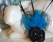 Black rosette with blue feather hair clip