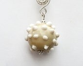 Beige morning star pendant