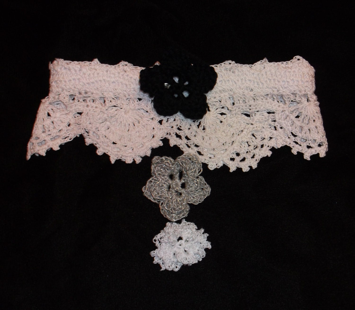 The Graceful De La Ronde Bridal Garter with three flower pins
