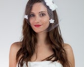 Infinite Love bridal birdcage veil with flower fascinator