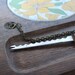 Vintage Cheese Board with Knife on a Chain. Retro Flower Pattern.