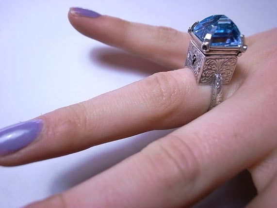 Locking Poison Ring with Key on Chain in Sterling Silver with Topaz and Sapphires