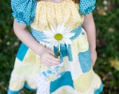 The Sunshine Patchwork Peasant Dress. Available in sizes 12m, 18m and 2T