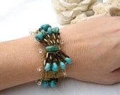 Vintage charm Bracelet, with turquoise stones, work beads, lace, and  knitted thin fine golden wire. Hand made