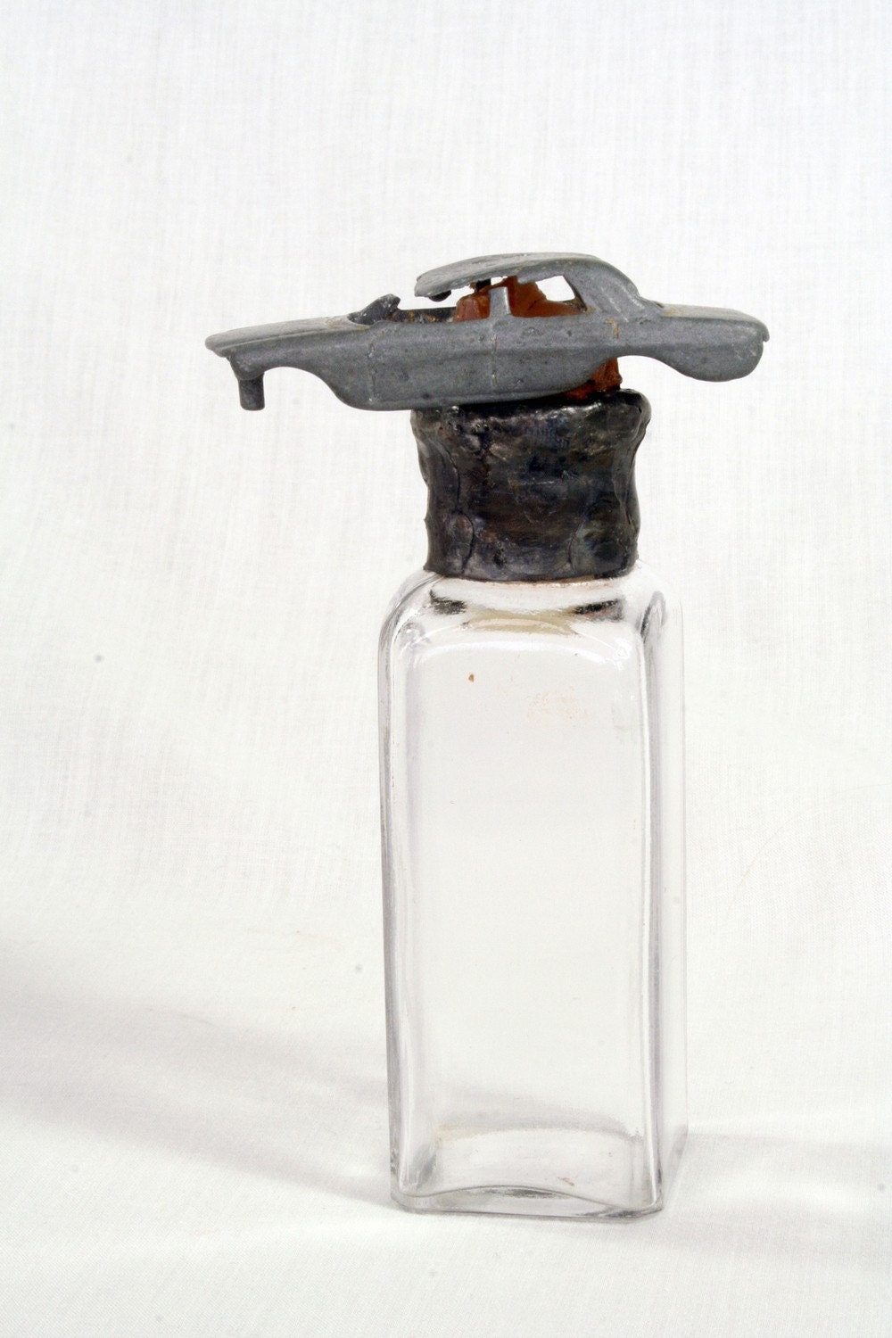 Vintage clear bottle with carnelian agate and matchbox car