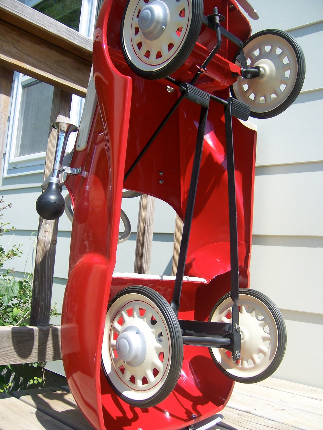 Vintage pedal car from mid to late 1930s in dazzling red now for sale. Original antique beautifully restored.