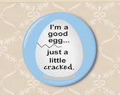 Egg cracked. Pinback button