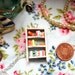 The Beach House Bookshelf Necklace by Coryographies