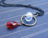 Orbit - Vintage Crystal, Czech Garnet, Brass Ring & Black Chain - NECKLACE