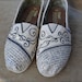 What is Love Theme - Ivory & Black Custom TOMS Shoes