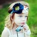 Teal Blue & Avocado Green Silky Satin Fabric Flower with Patterned Leaves on a Soft Stretchy Headband