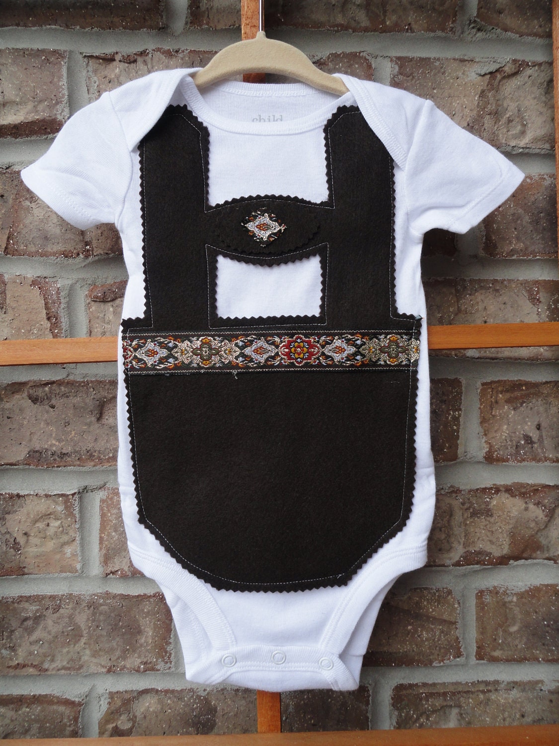 Traditional brown baby lederhosen onesie