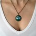A letter Lost In Time, Bronze Plated Drop Cabochon Setting on a Chain
