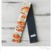 ruched camera strap cover - orange/aqua