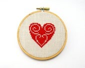 Red heart cross stitch in wooden hoop