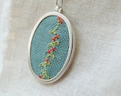Hand embroidered necklace branch with flowers on green