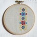 Ukrainian ornament hand embroidery cross stitch in wooden hoop