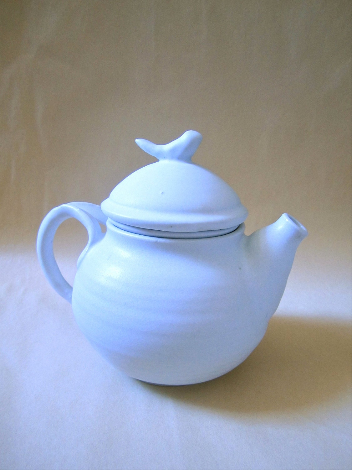 white porcelain teapot with bird knob lid, handmade tea filter