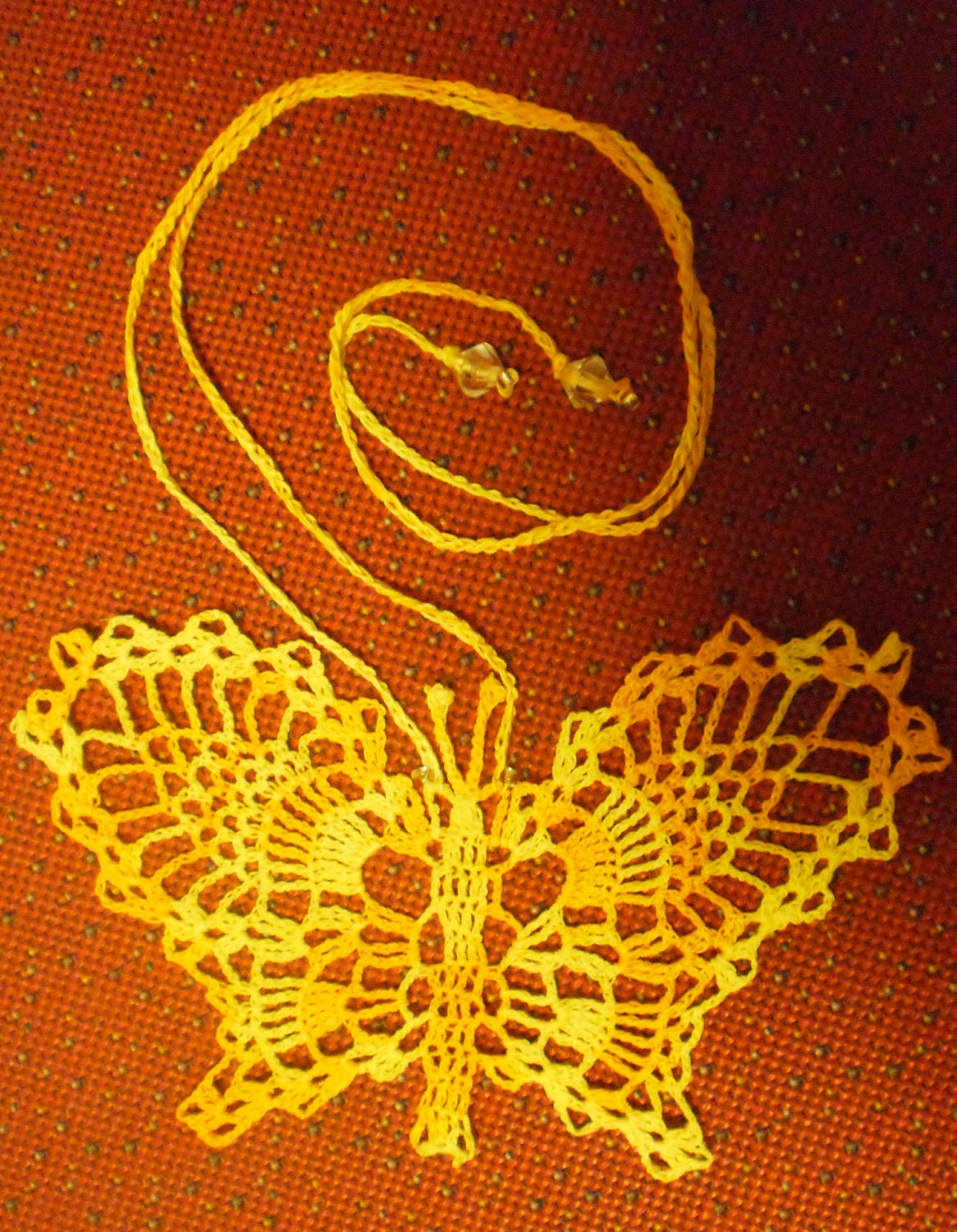 Fine crocheted butterfly sunny necklace for a girl or young lady.