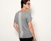 Gray women  v knitted blouse with a silver sheer stripe on the back
