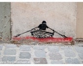 Paris graffiti - rowboat on a red sea -  stencil, pastel, boat, cobblestones, wall, black-  8" x 12" Original Fine Art Photograph