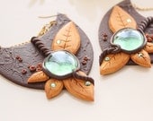 Lunar blossom arrows Earrings - Polymer clay chocolate earrings with green glass drop