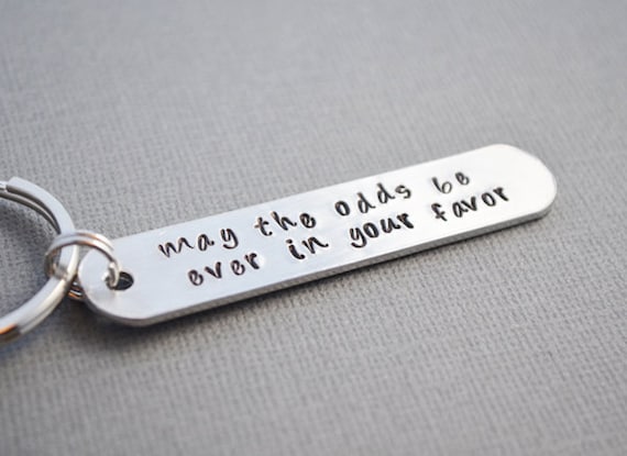 Hunger Games May the odds be EVER in your favor keychain hand stamped by TheCopperFox