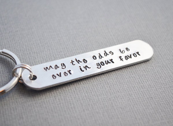 Hunger Games May the odds be EVER in your favor keychain hand stamped by TheCopperFox
